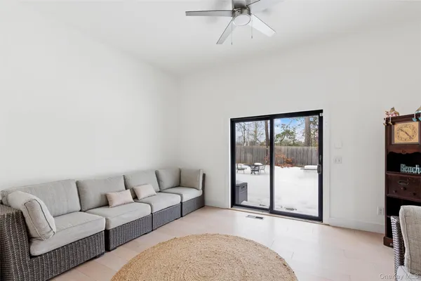 a living room with furniture and a gate