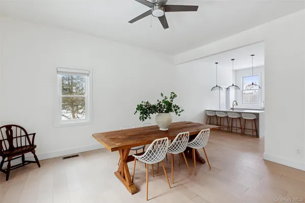 a dining room with furniture and window