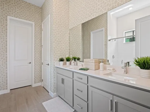 a view of a workspace with a table and a potted plant