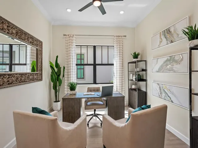 a living room with furniture and a floor to ceiling window