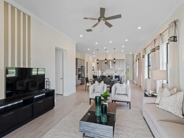 a kitchen with a sink a counter top stainless steel appliances and cabinets