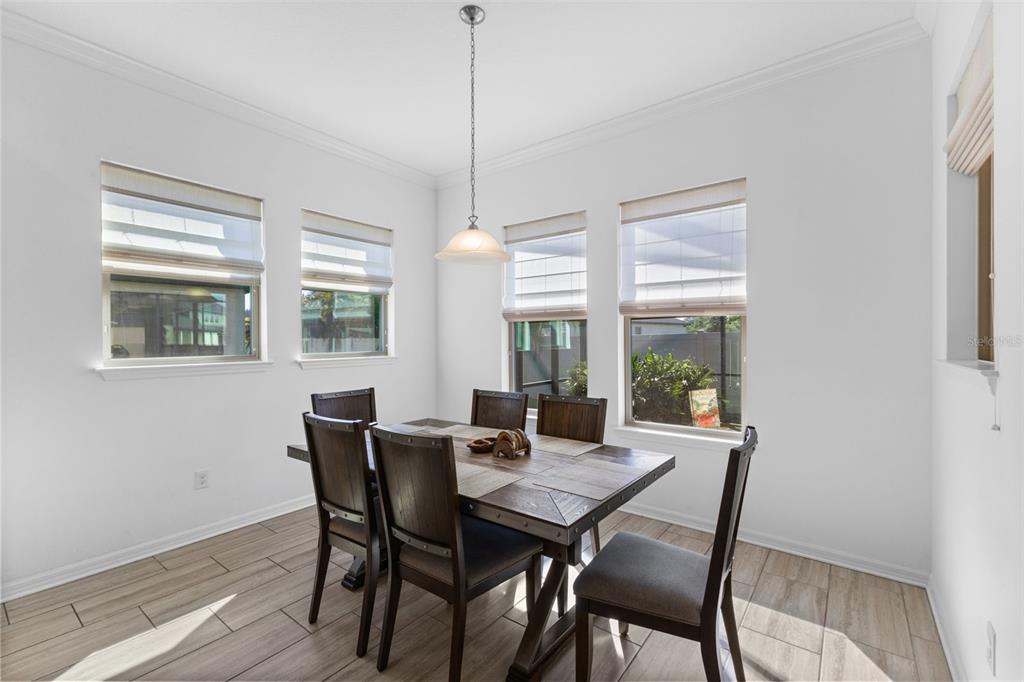 13065 Bliss Loop Bradenton, FL 34211 - Photo 13 of 54 a view of a dining room with furniture window and outside view