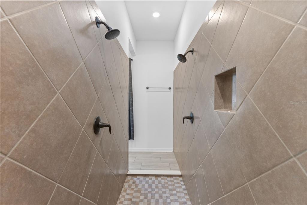 13065 Bliss Loop Bradenton, FL 34211 - Photo 21 of 54 a bathroom with a shower