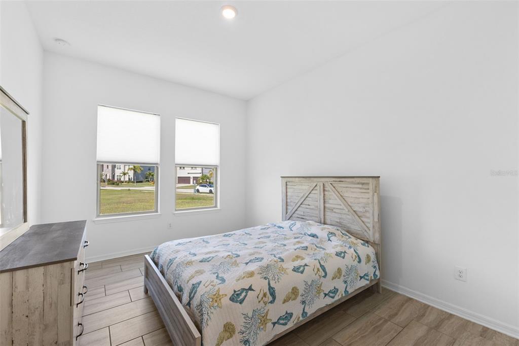 13065 Bliss Loop Bradenton, FL 34211 - Photo 24 of 54 a bedroom with a bed and a window