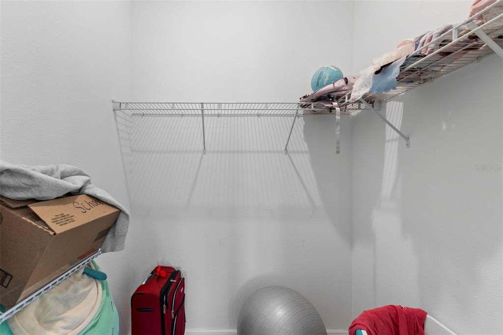 13065 Bliss Loop Bradenton, FL 34211 - Photo 25 of 54 a view of room with a hallway and a wooden floor