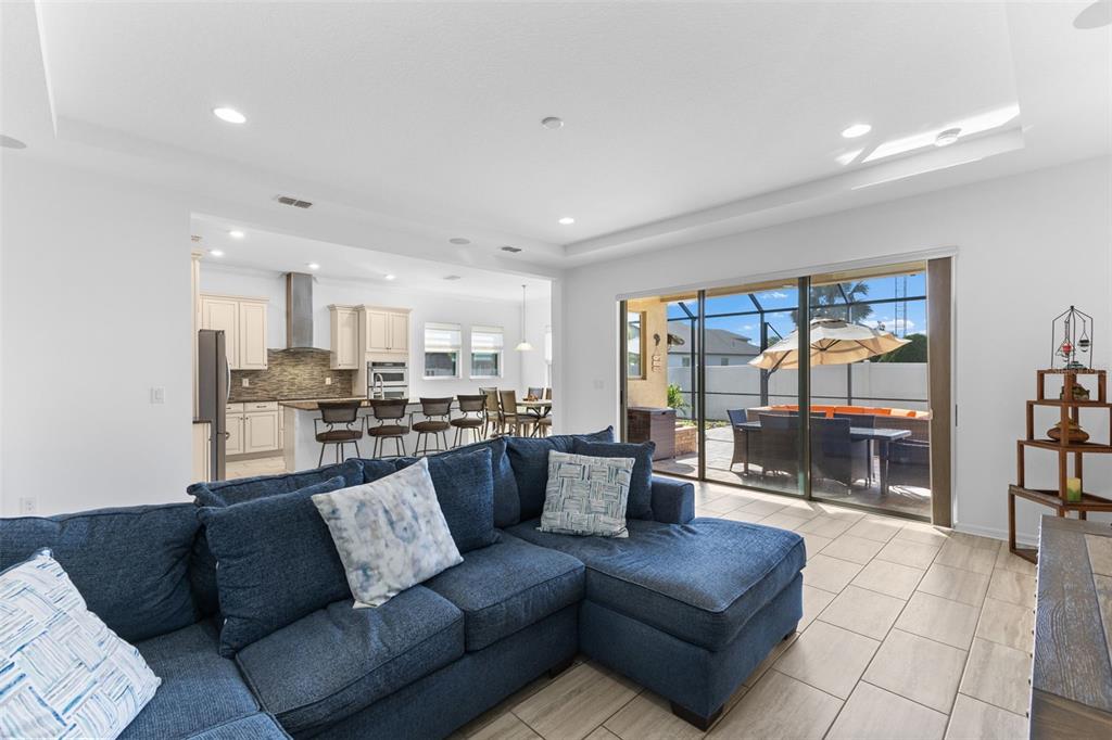 13065 Bliss Loop Bradenton, FL 34211 - Photo 3 of 54 a living room with furniture and a large window