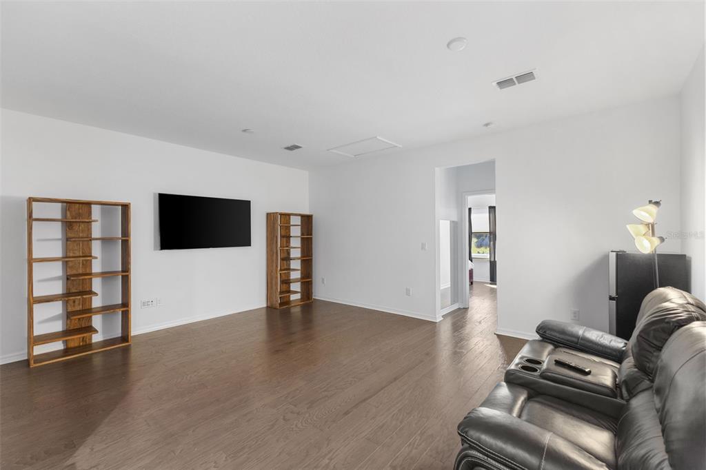13065 Bliss Loop Bradenton, FL 34211 - Photo 31 of 54 a view of a livingroom with a flat screen tv