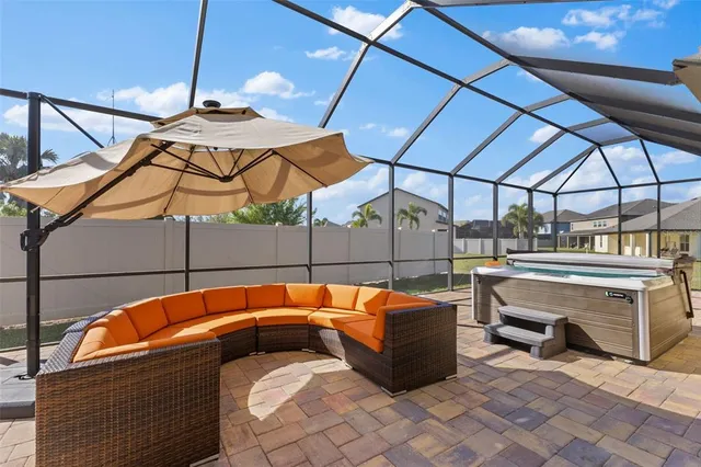 a outdoor space with patio the couches and a umbrella