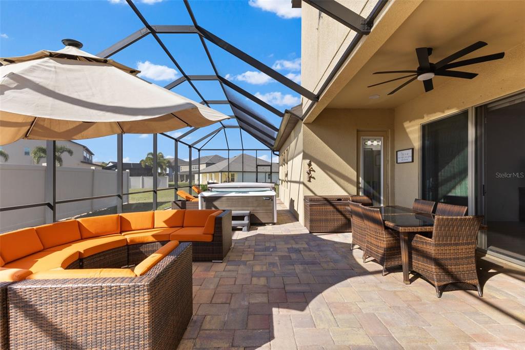 13065 Bliss Loop Bradenton, FL 34211 - Photo 40 of 54 a outdoor space with patio the couches and a umbrella