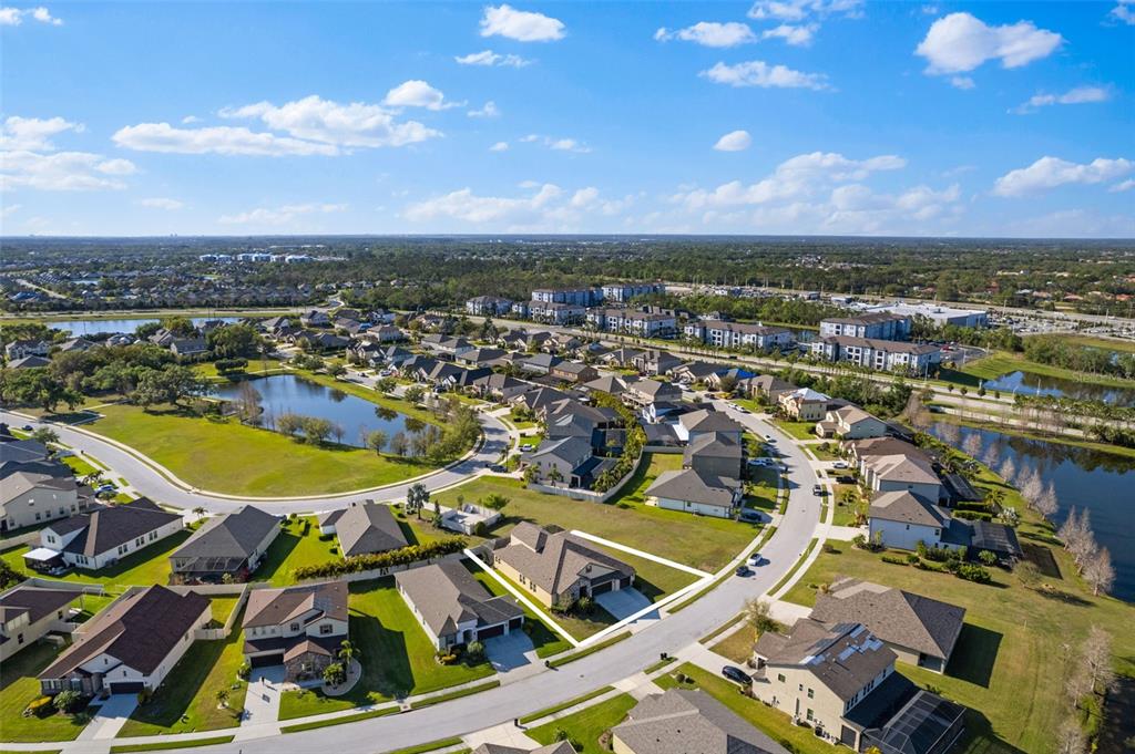 13065 Bliss Loop Bradenton, FL 34211 - Photo 51 of 54 an aerial view of residential houses with outdoor space and swimming pool