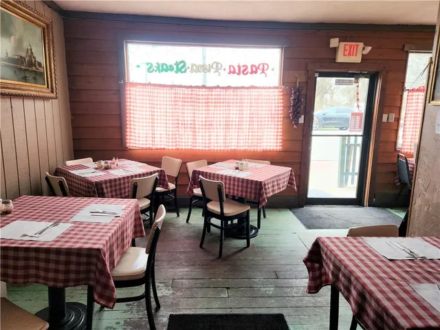 a view of a dining room with furniture and window
