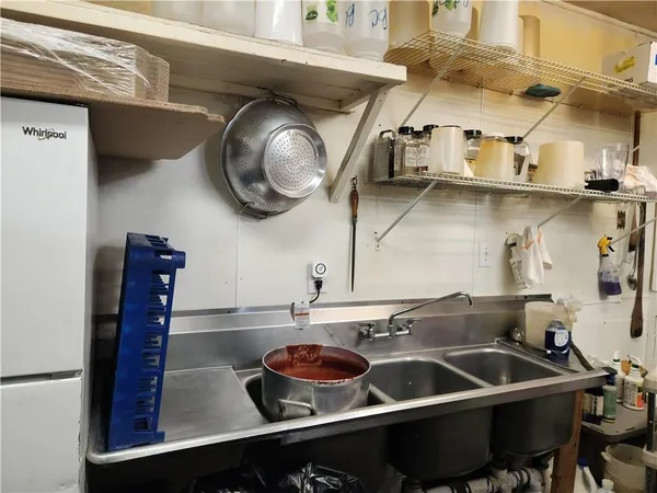 a kitchen with a stove and a sink