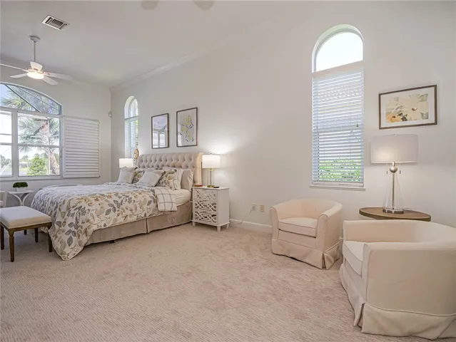 a bedroom with bed and a window