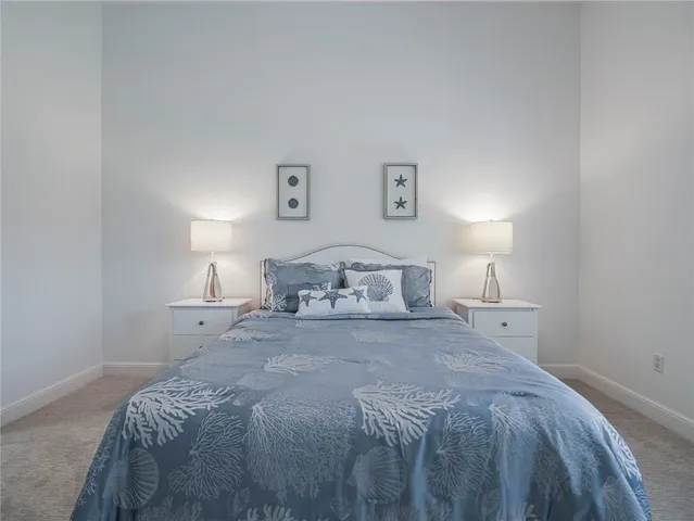 a bedroom with a bed and a night lamp