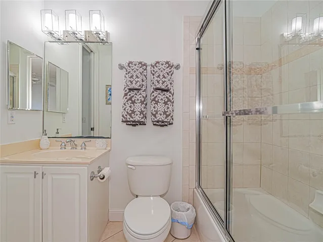 a bathroom with a toilet sink and shower