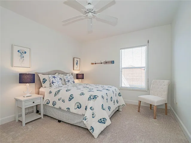 a bedroom with a bed and a chair