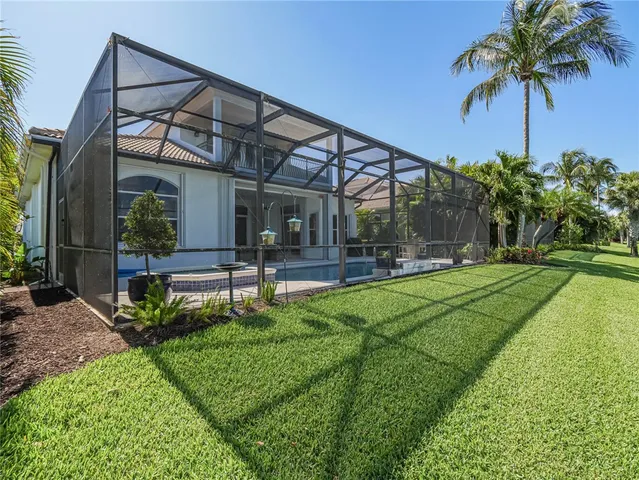 swimming pool view with a seating space