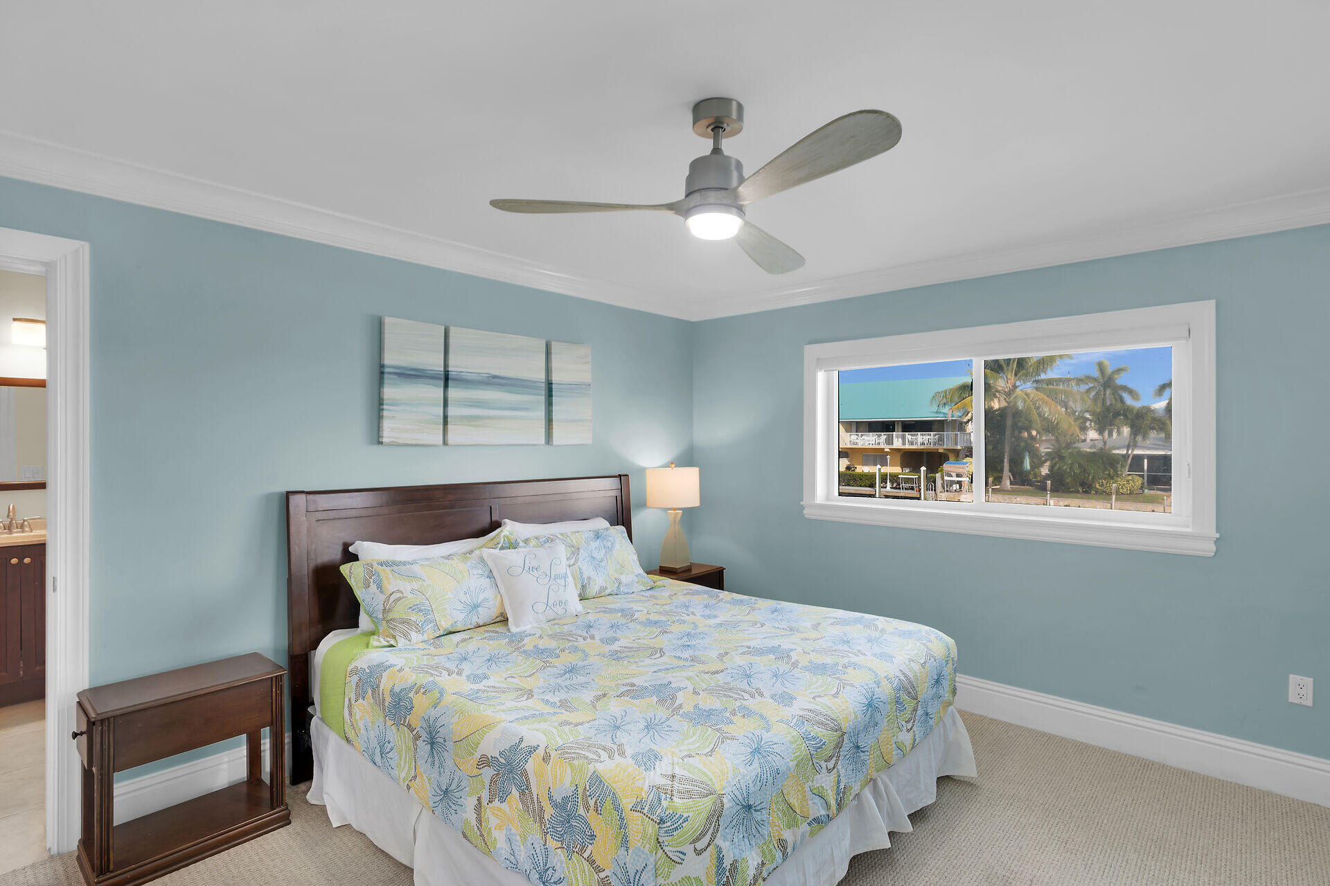 580-590 10th Street Key Colony Beach, FL 33051 - Photo 53 of 75 a bedroom with a bed and a window