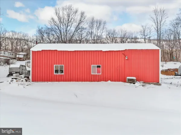 a view of a kitchen with a sink and cabinets