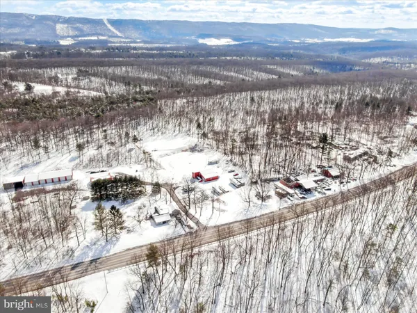 a view of snow on the side of the road