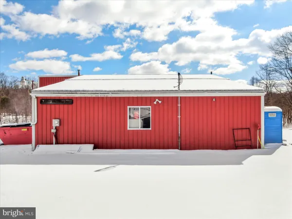 a view of a kitchen with a sink and cabinets