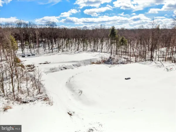 a view of snow on the side of the road
