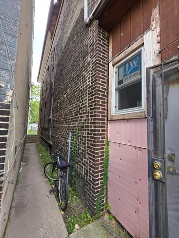 a backyard of a house with outdoor seating