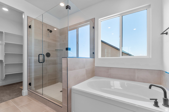 1341 West 2350 South, Unit 10 Perry, UT 84302 - Photo 12 of 18 Full bathroom featuring a glass-enclosed shower with matte black fixtures, a soaking tub with a matte black faucet, and tiled flooring