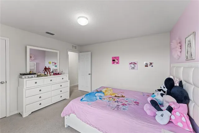 a bedroom with a bed and closet