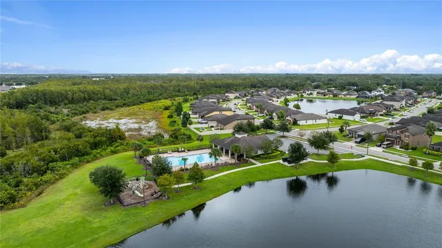 a view of a golf course with parking space