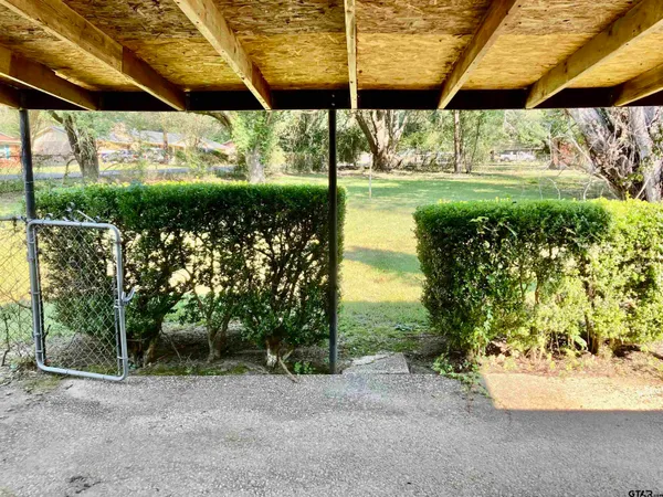 a view of a backyard with a garden and plants