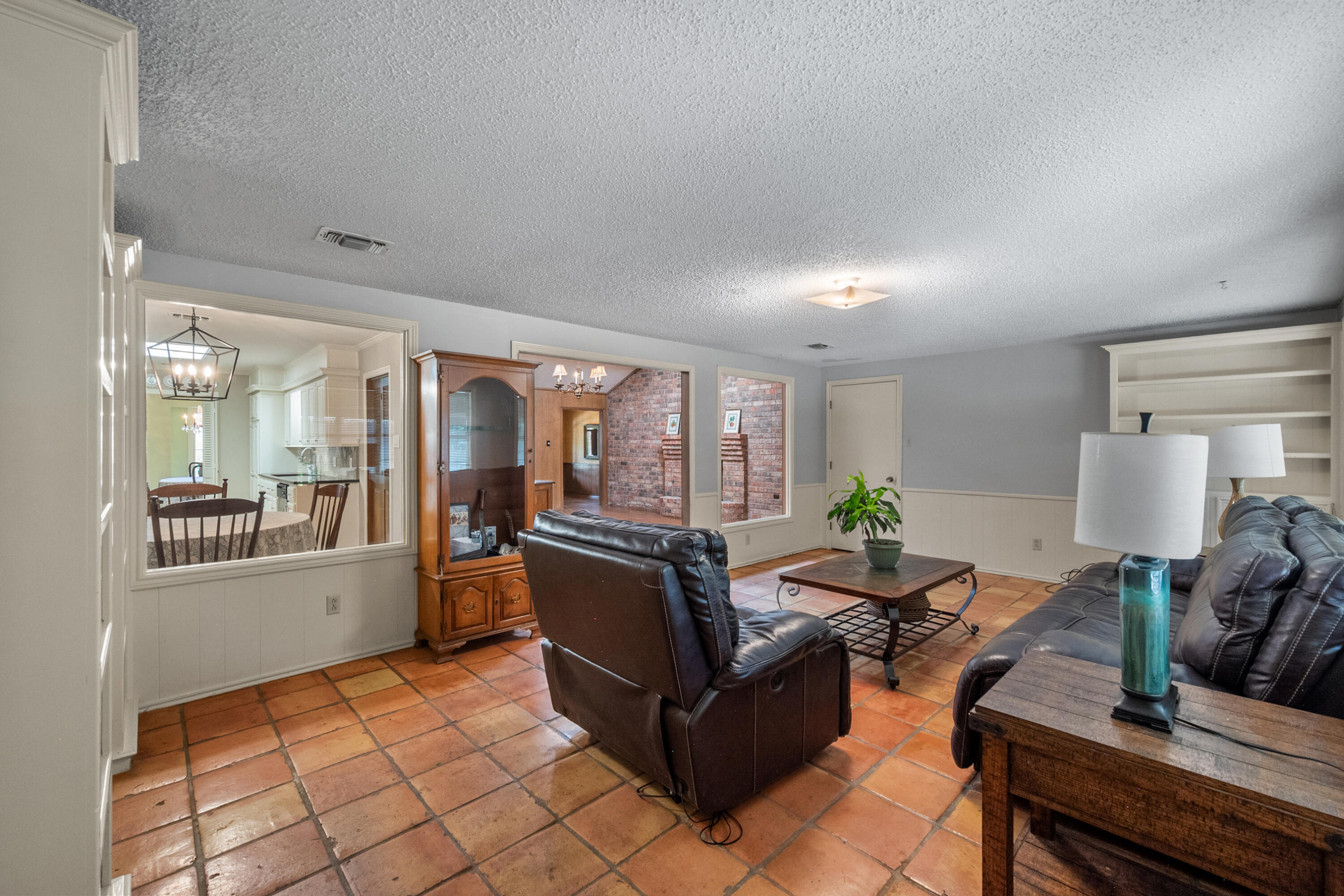 3801 66th Street Lubbock, TX 79413 - Photo 11 of 36 a living room with furniture and large windows