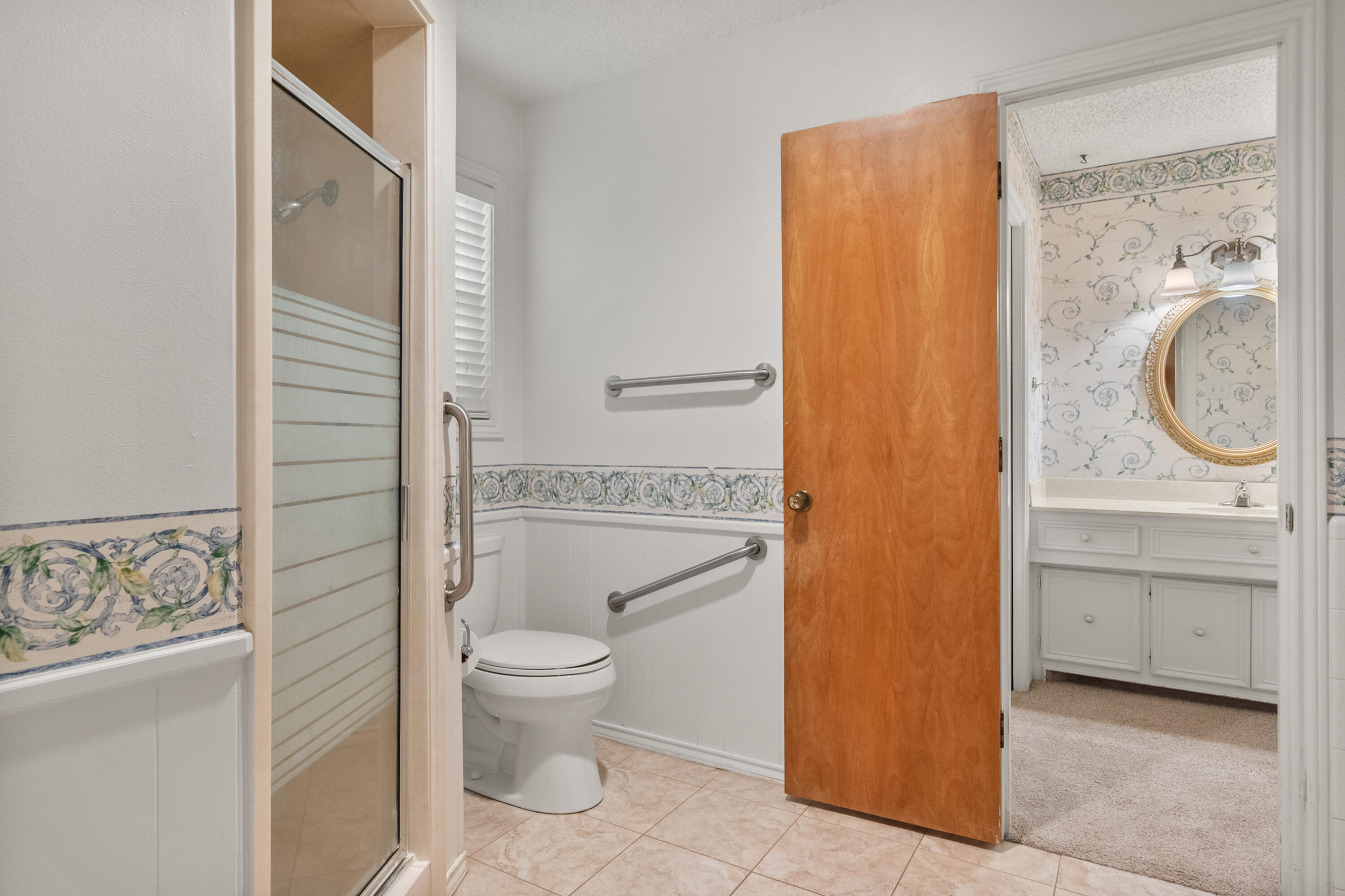 3801 66th Street Lubbock, TX 79413 - Photo 20 of 36 a bathroom with a granite countertop sink toilet and shower