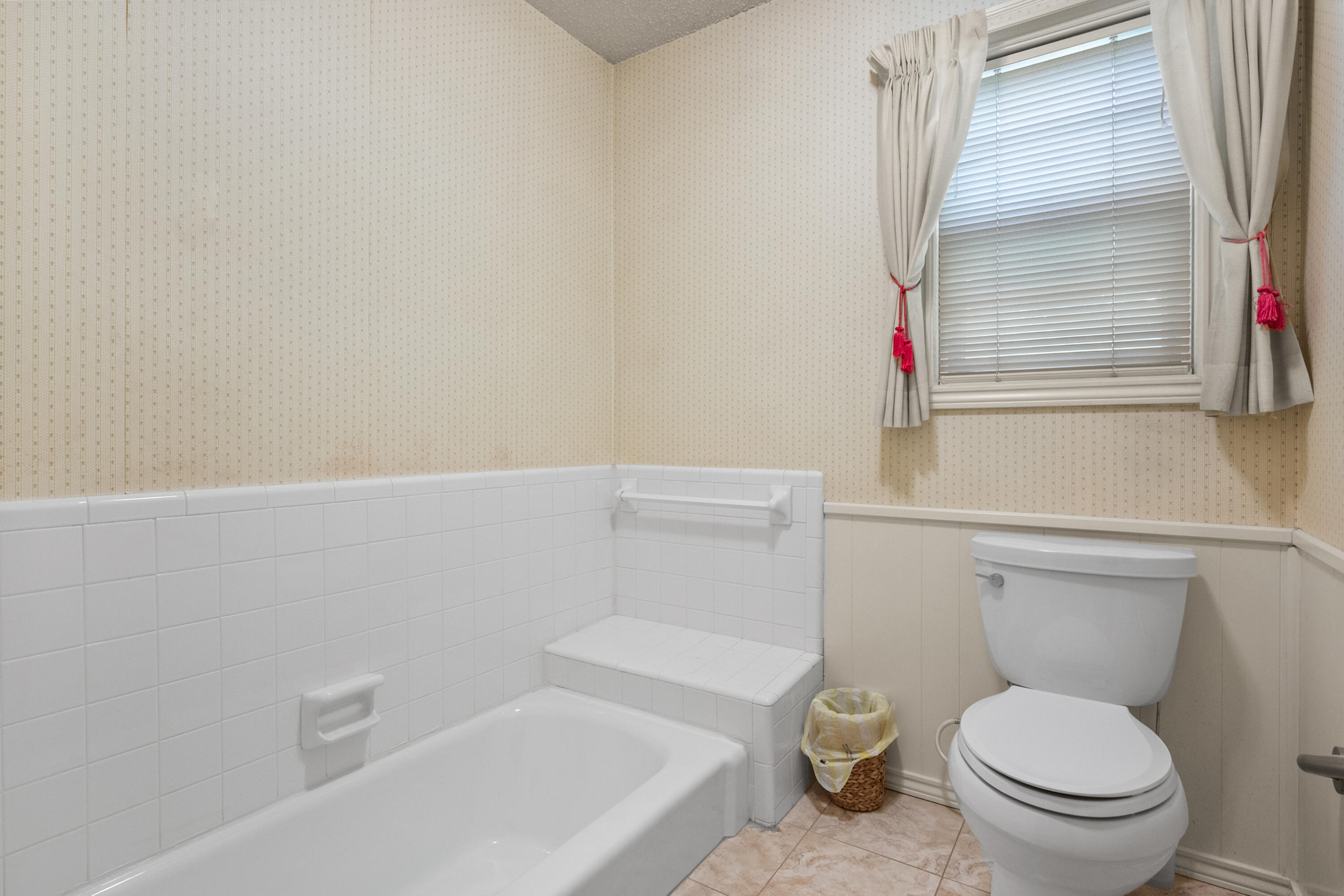 3801 66th Street Lubbock, TX 79413 - Photo 24 of 36 a white toilet sitting next to a white tub