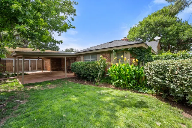 a front view of a house with a yard and porch