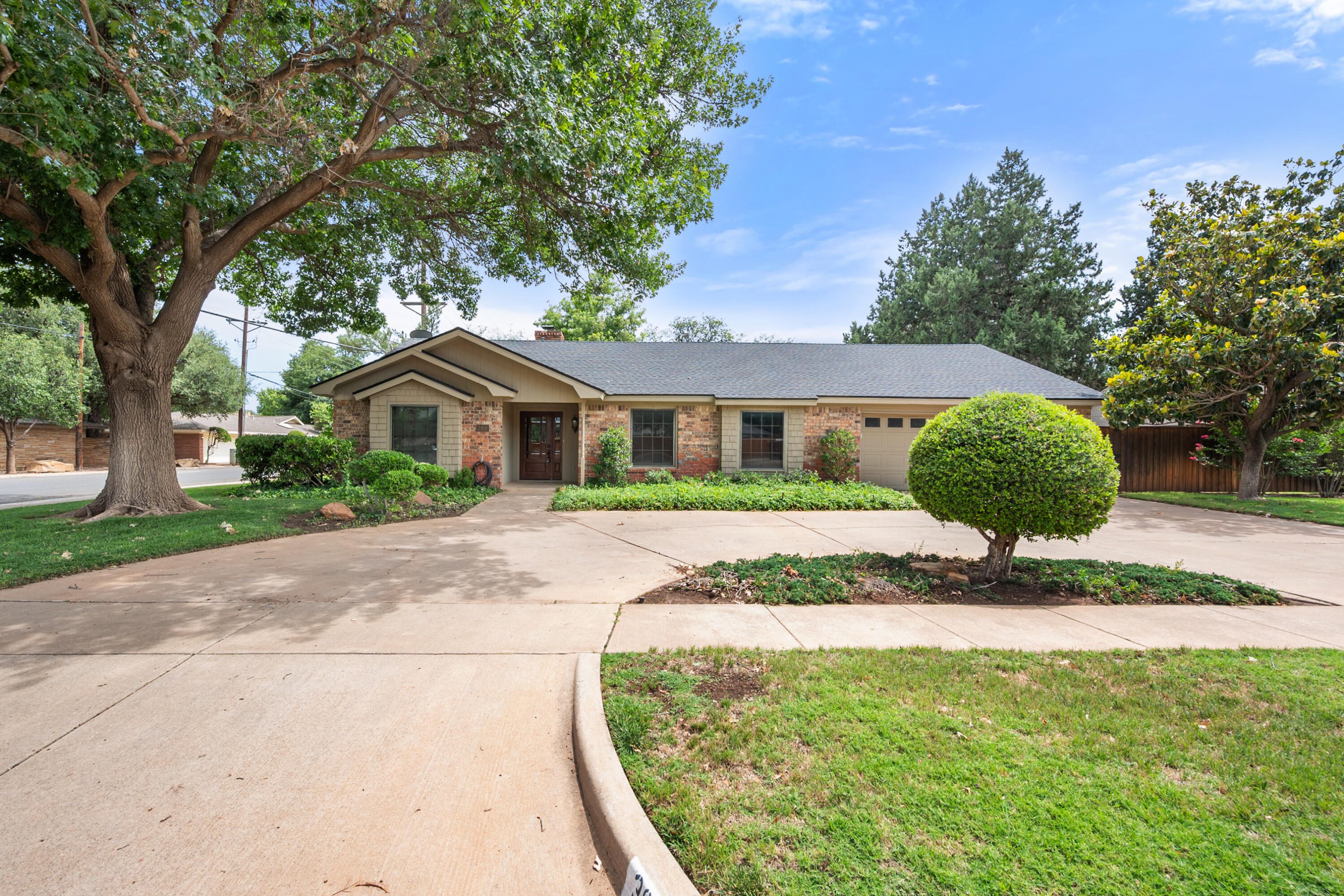 3801 66th Street Lubbock, TX 79413 - Photo 32 of 36 a front view of a house with a yard