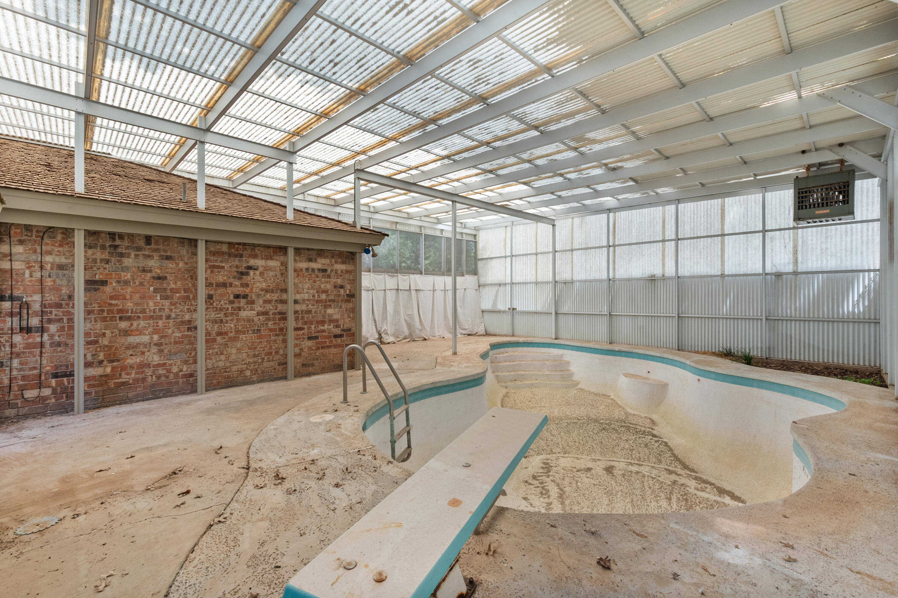 3801 66th Street Lubbock, TX 79413 - Photo 34 of 36 a view of a backyard with wooden walls