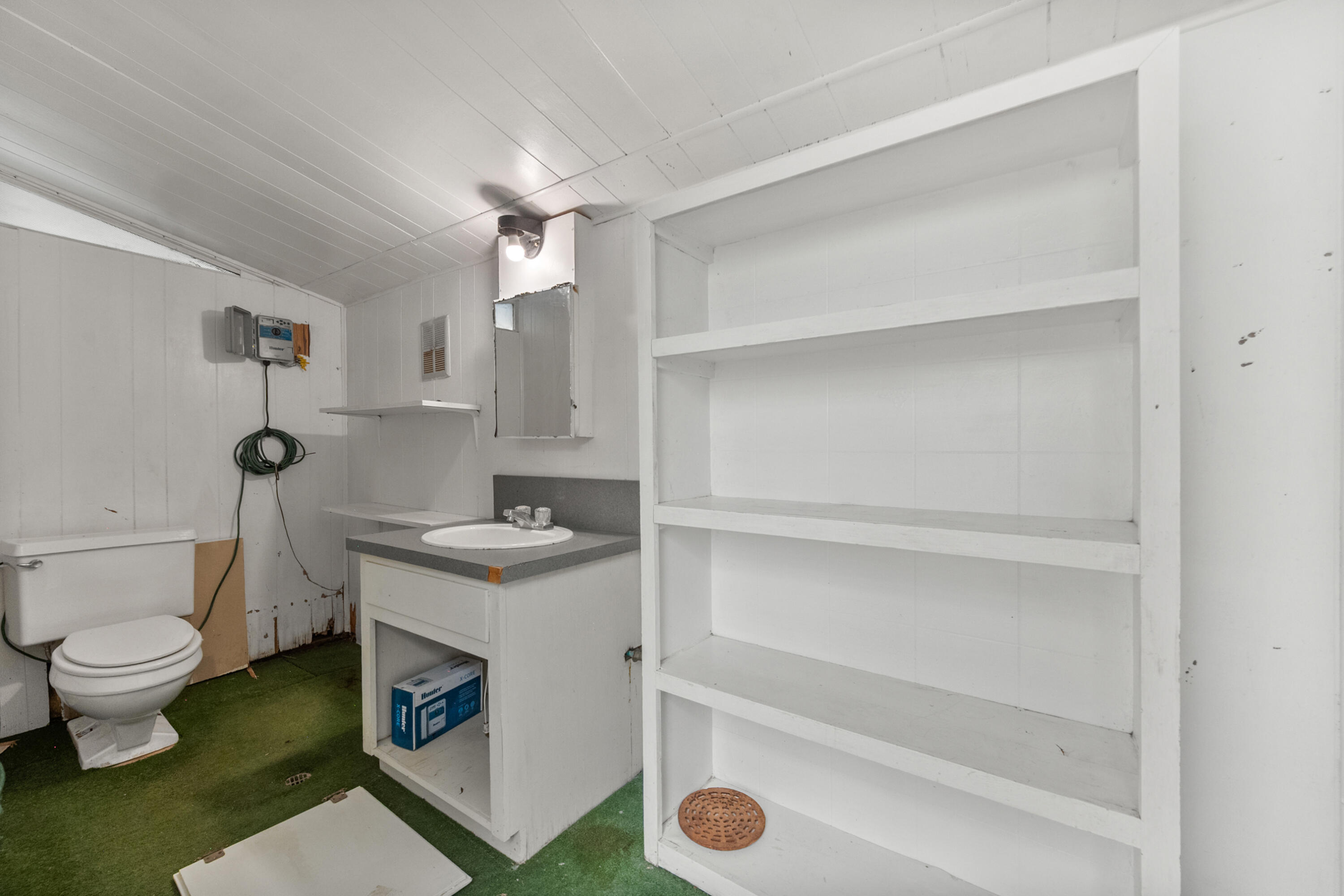 3801 66th Street Lubbock, TX 79413 - Photo 35 of 36 a bathroom with a sink toilet and shower