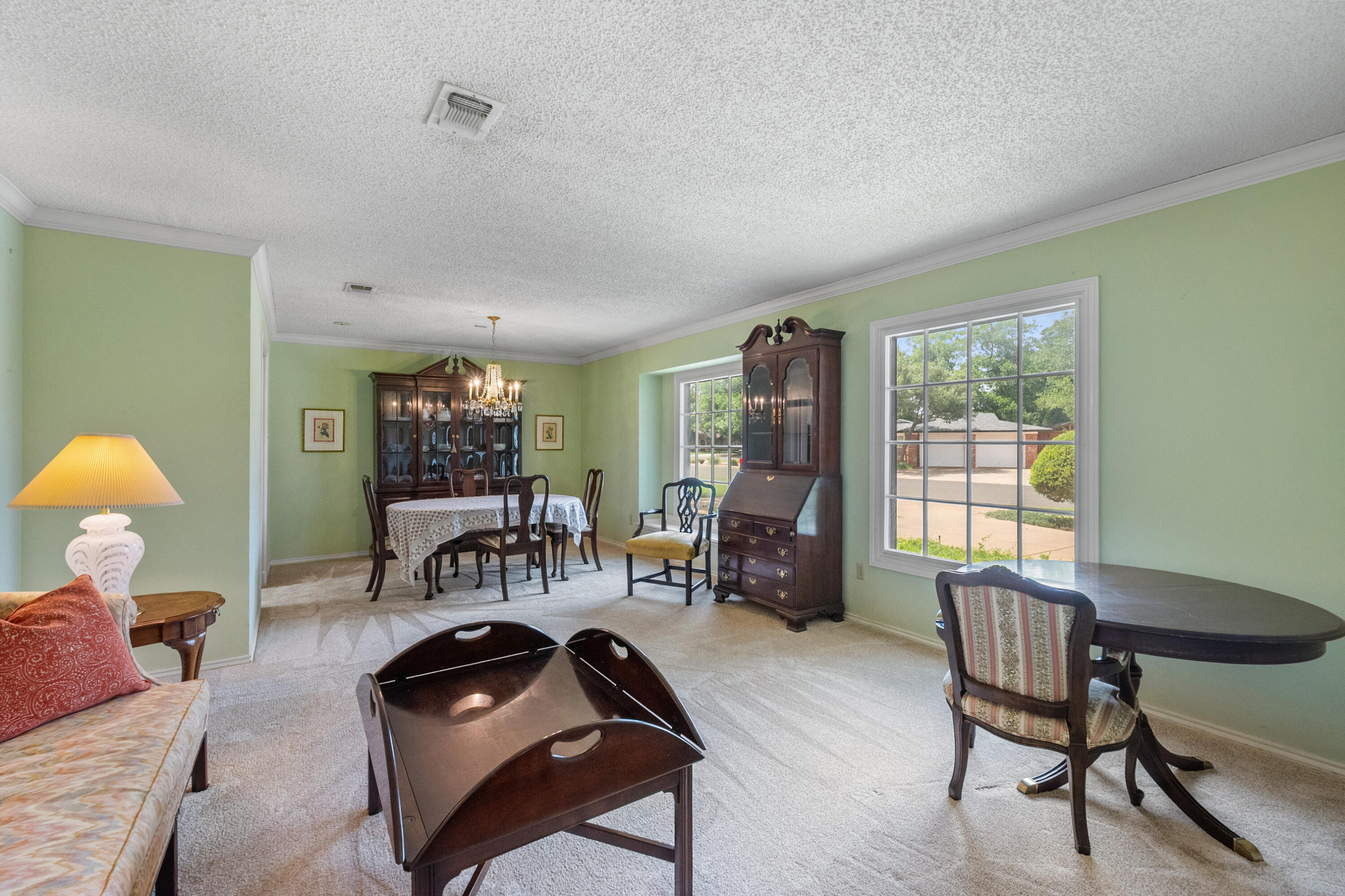 3801 66th Street Lubbock, TX 79413 - Photo 7 of 36 a living room with furniture and a window