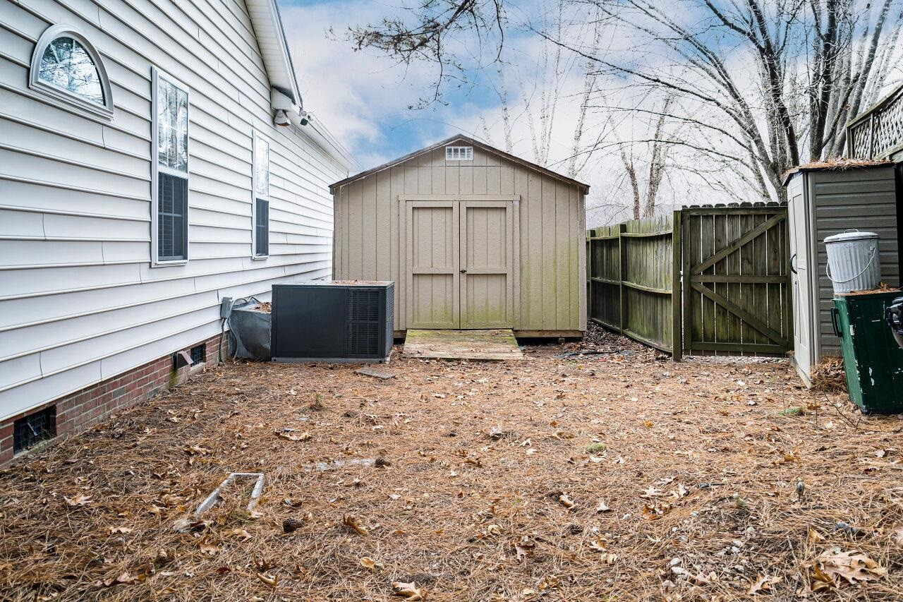 600 Three Meadows Road Fuquay-Varina, NC 27526 - Photo 28 of 30 The storage building is ideal for storing lawn equipment, etc. Storage Building