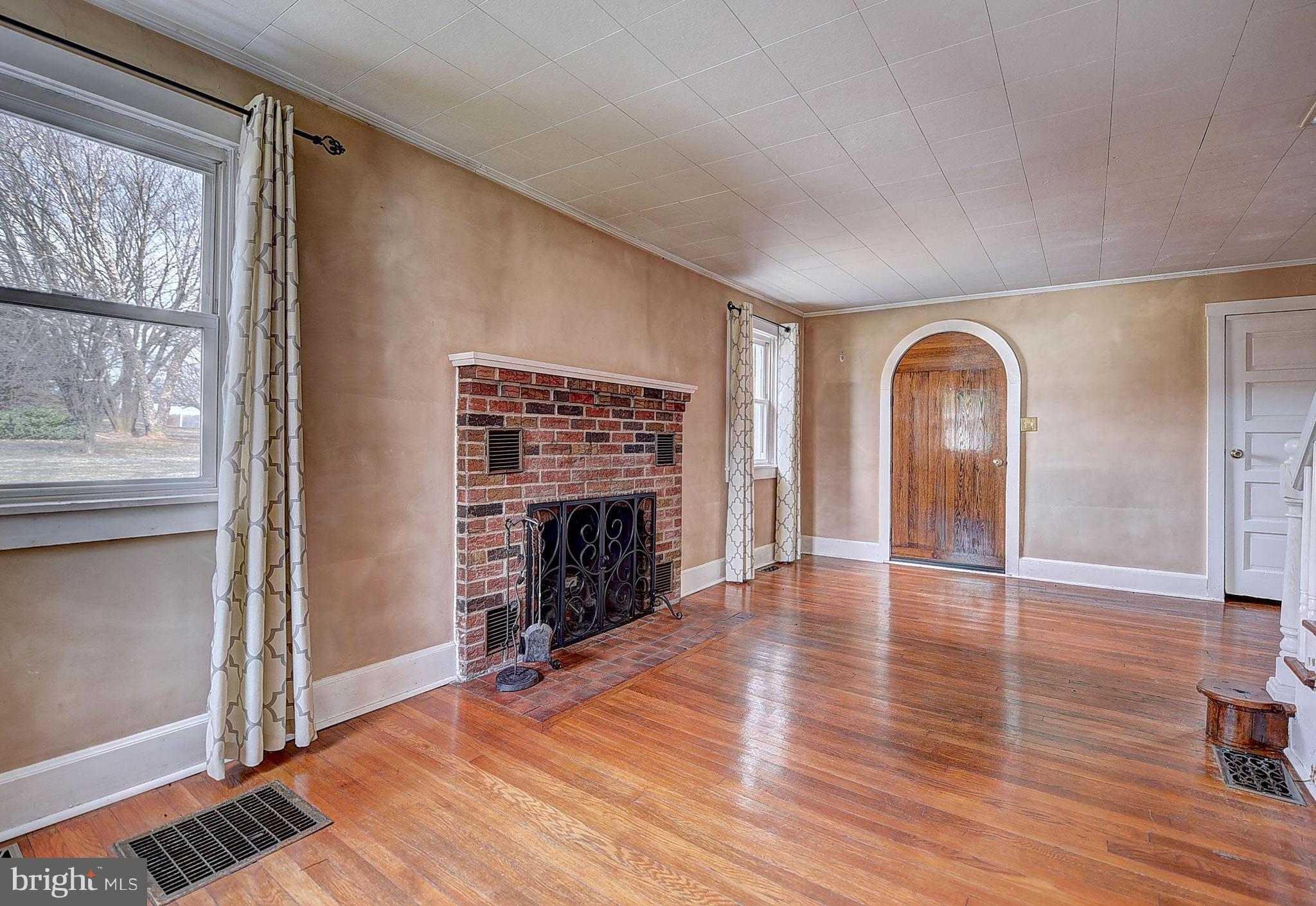 387 Rock Springs Road Conowingo, MD 21918 - Photo 7 of 25 Charm preserved with the brick fireplace