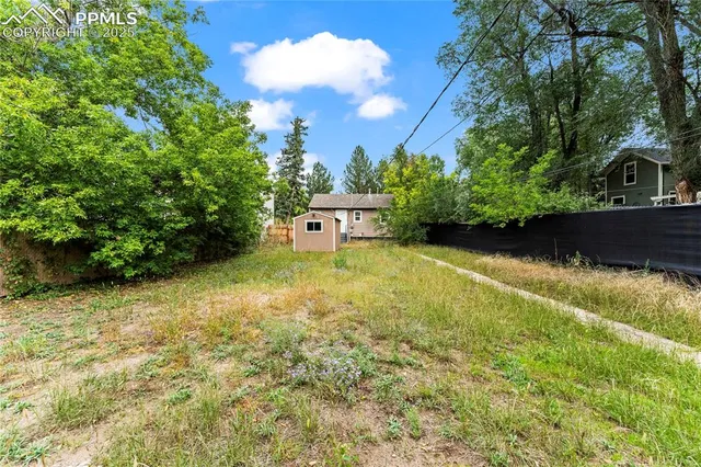 a view of a yard with an outdoor space