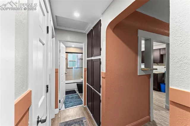 a bathroom with a mirror and a shower