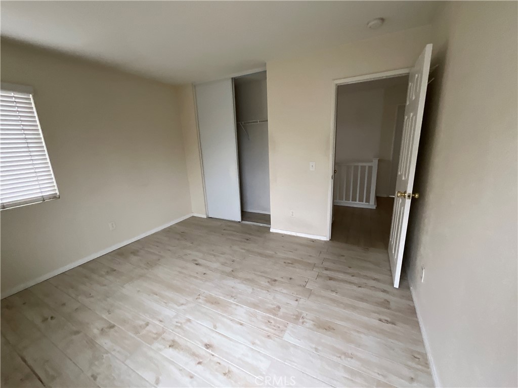 11875 Cedarbrook Place Rancho Cucamonga, CA 91730 - Photo 11 of 26 an empty room with wooden door