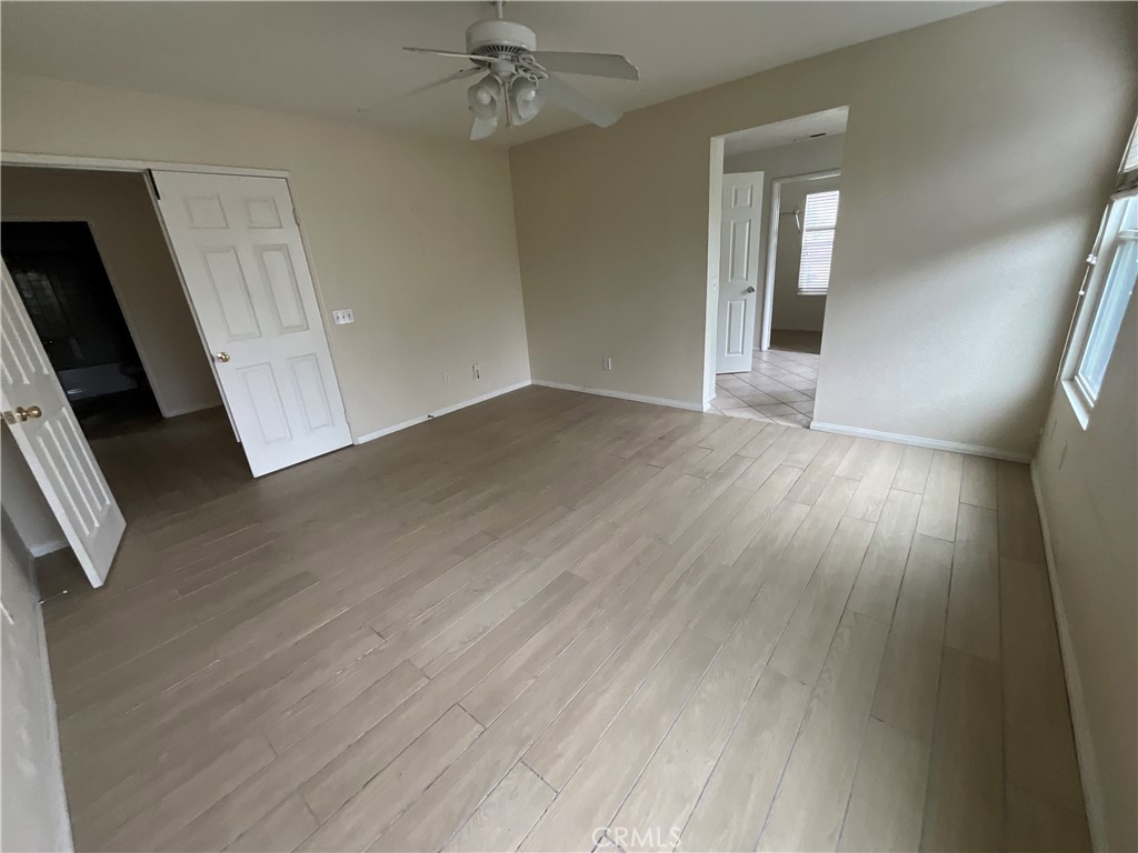 11875 Cedarbrook Place Rancho Cucamonga, CA 91730 - Photo 16 of 26 wooden floor in an empty room with a window