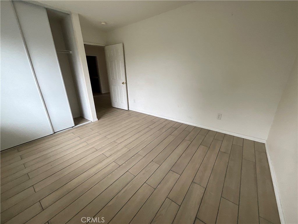 11875 Cedarbrook Place Rancho Cucamonga, CA 91730 - Photo 18 of 26 a view of empty room with wooden floor