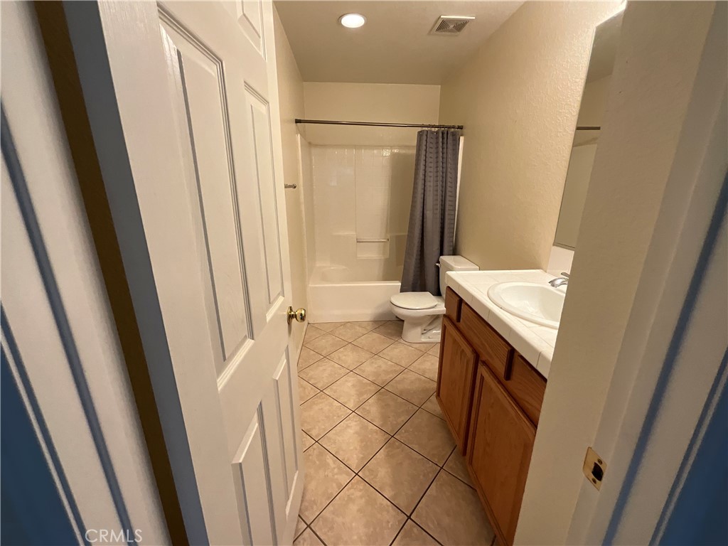11875 Cedarbrook Place Rancho Cucamonga, CA 91730 - Photo 21 of 26 a bathroom with a sink and a toilet
