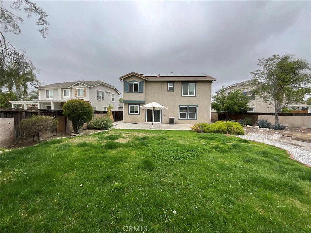 11875 Cedarbrook Place Rancho Cucamonga, CA 91730 - Photo 25 of 26 a front view of a house with garden and trees