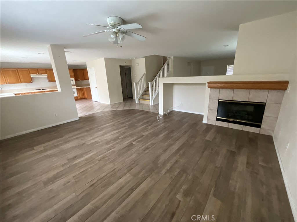 11875 Cedarbrook Place Rancho Cucamonga, CA 91730 - Photo 5 of 26 wooden floor fireplace and windows in an empty room