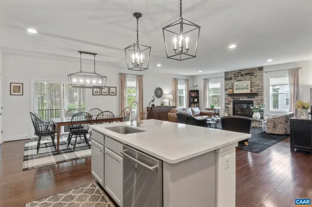 a large kitchen with a table and chairs
